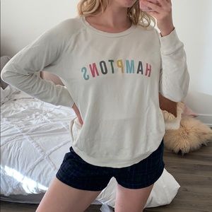 Hampton’s white sweater